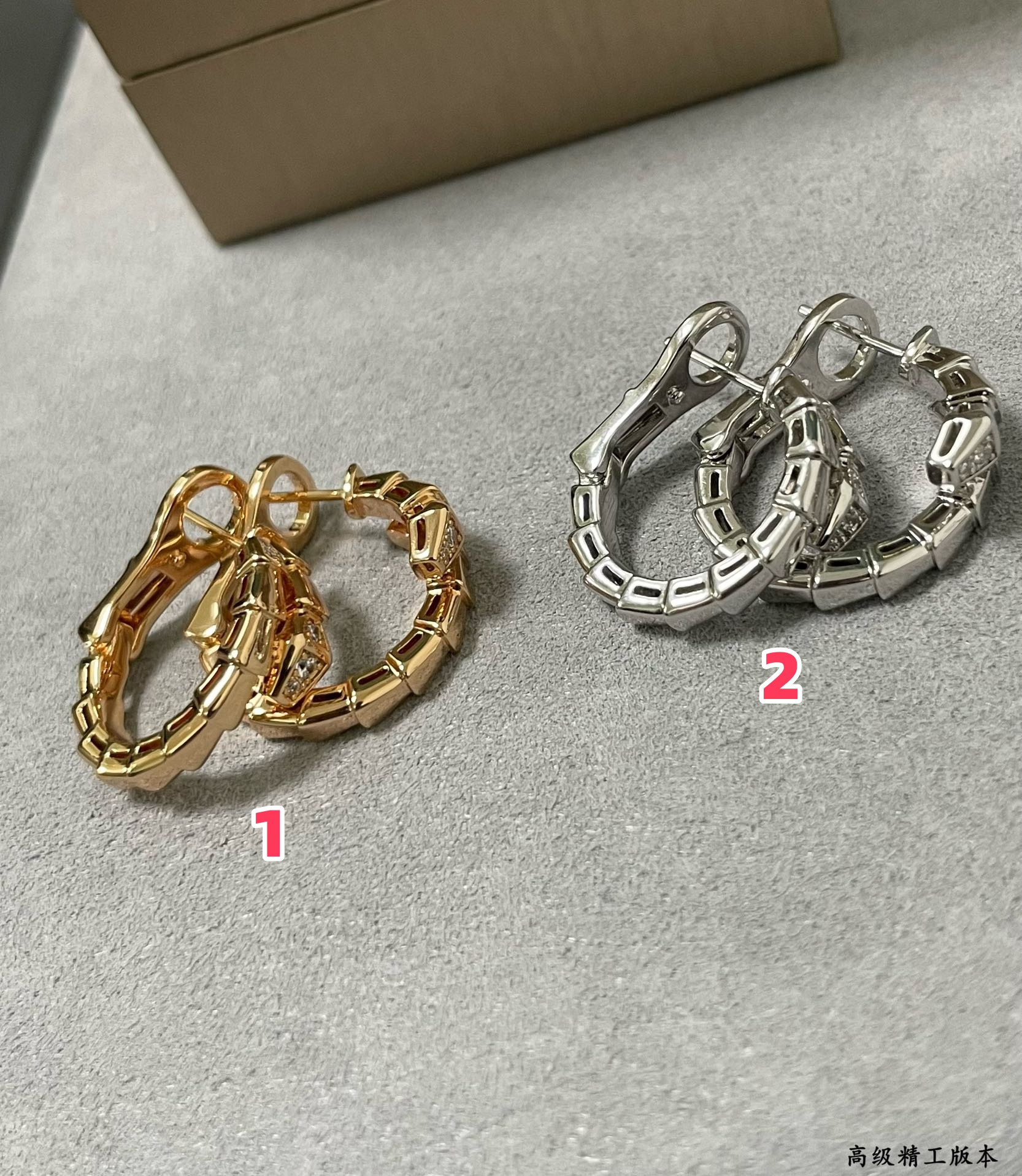 B*l*ai head and tail drill snake earrings