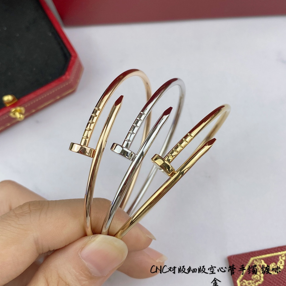 Ca*t*er thin hollow tube polished nail bracelet