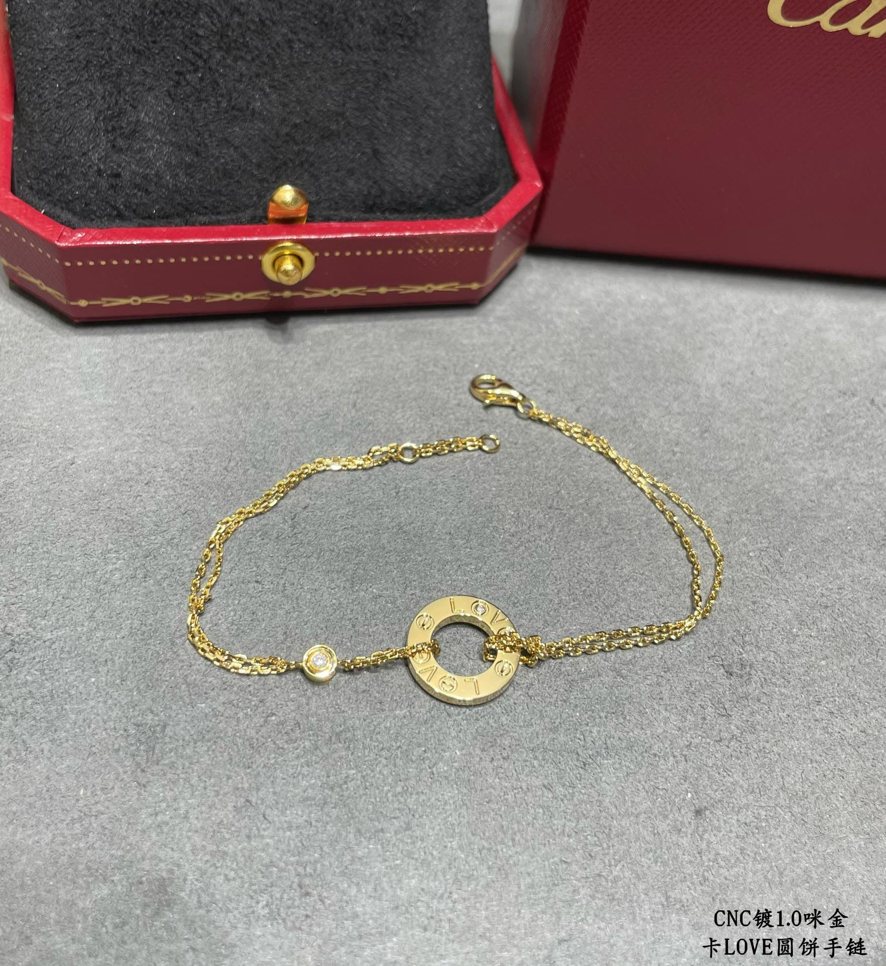 Ca*t*er double-sided coin bracelet