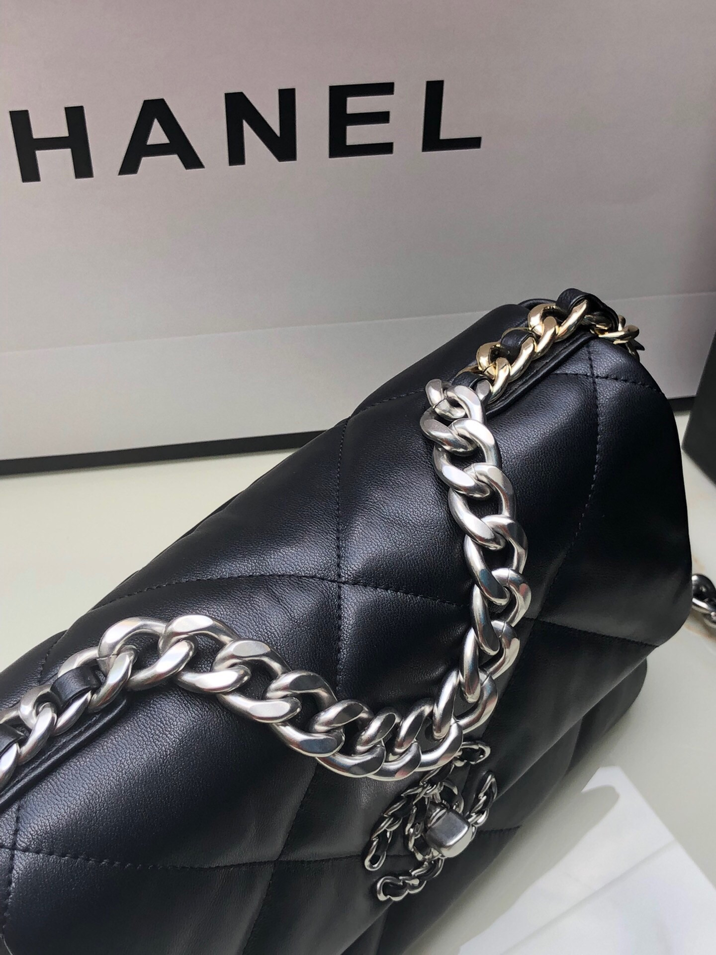 Ch*el 19 handbag shiny leather, gold-tone, silver-tone & ruthenium-finish metal black 6.2 × 10.1 × 3.5 in