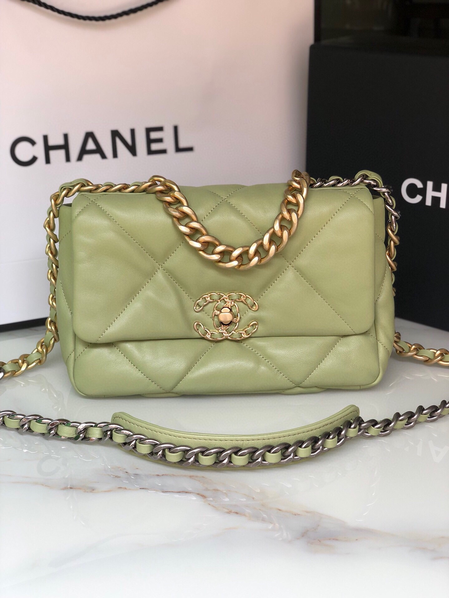 Ch*el 19 handbag shiny leather, gold-tone, silver-tone & ruthenium-finish metal light green 6.2 × 10.1 × 3.5 in