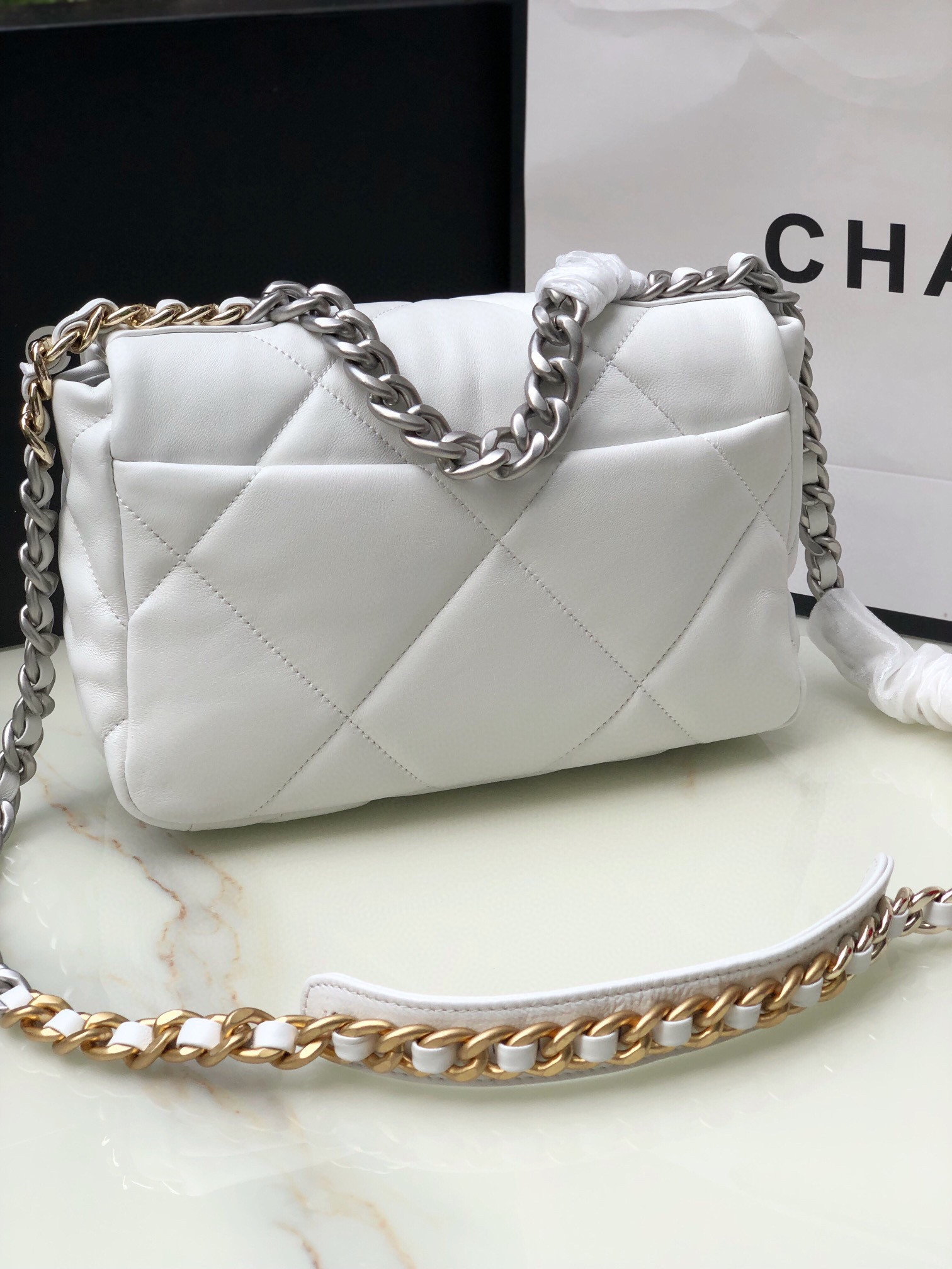 Ch*el 19 handbag shiny leather, gold-tone, silver-tone & ruthenium-finish metal white 6.2 × 10.1 × 3.5 in