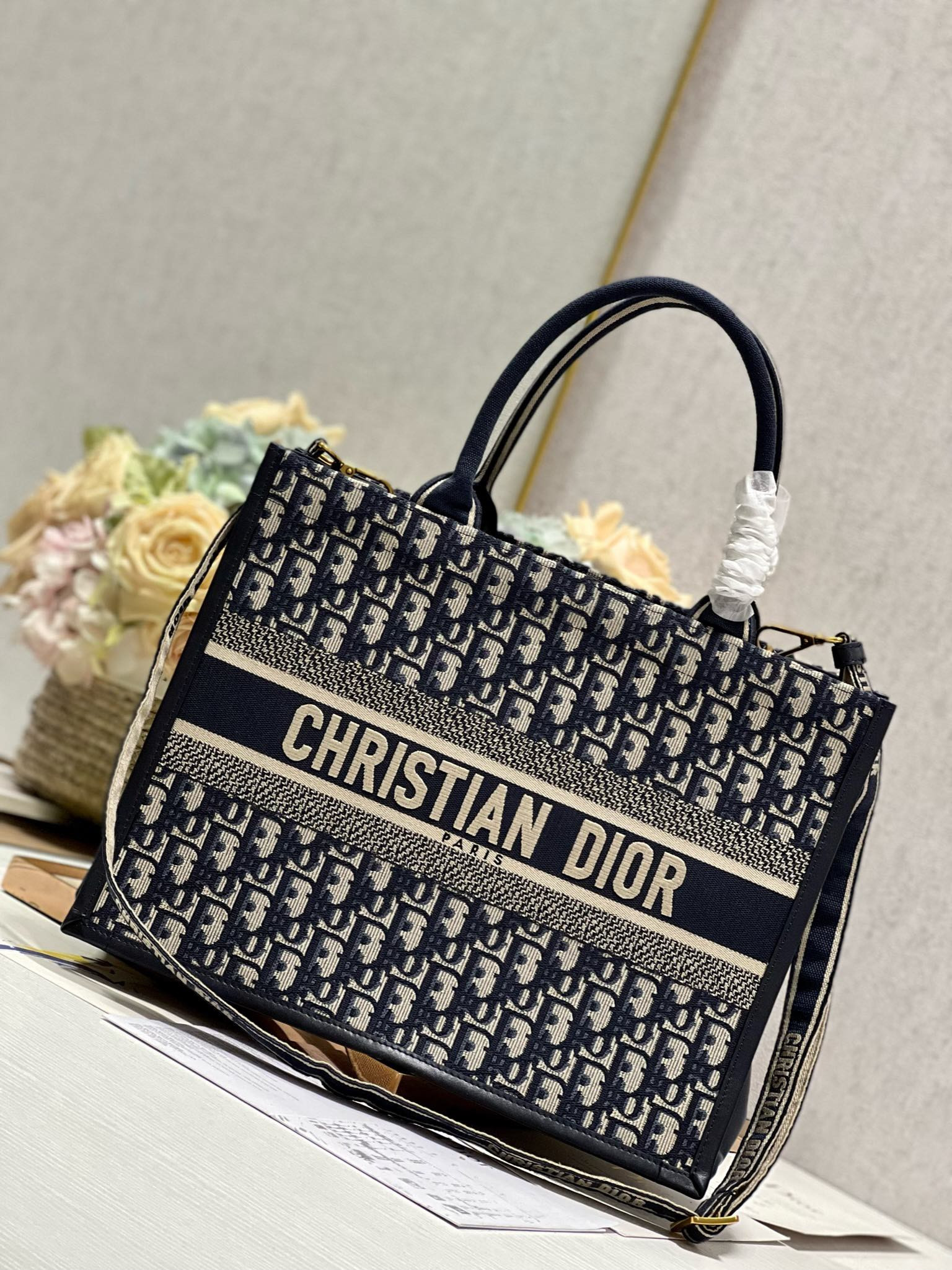 medium D*or book tote ecru and blue D*or oblique embroidery 14 x 11 x 6.5 inches
