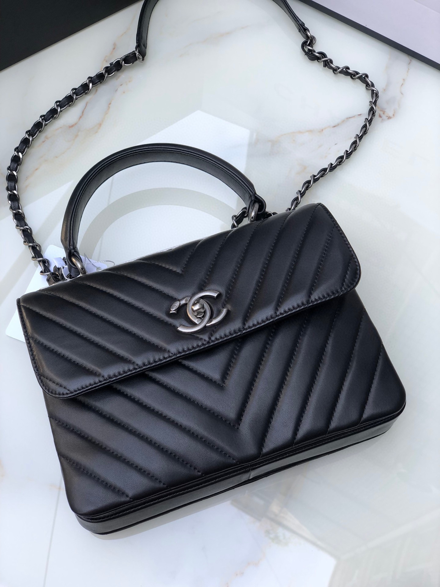 Ch*el flap bag with top handle 6.6 × 9.8 × 4.7 in