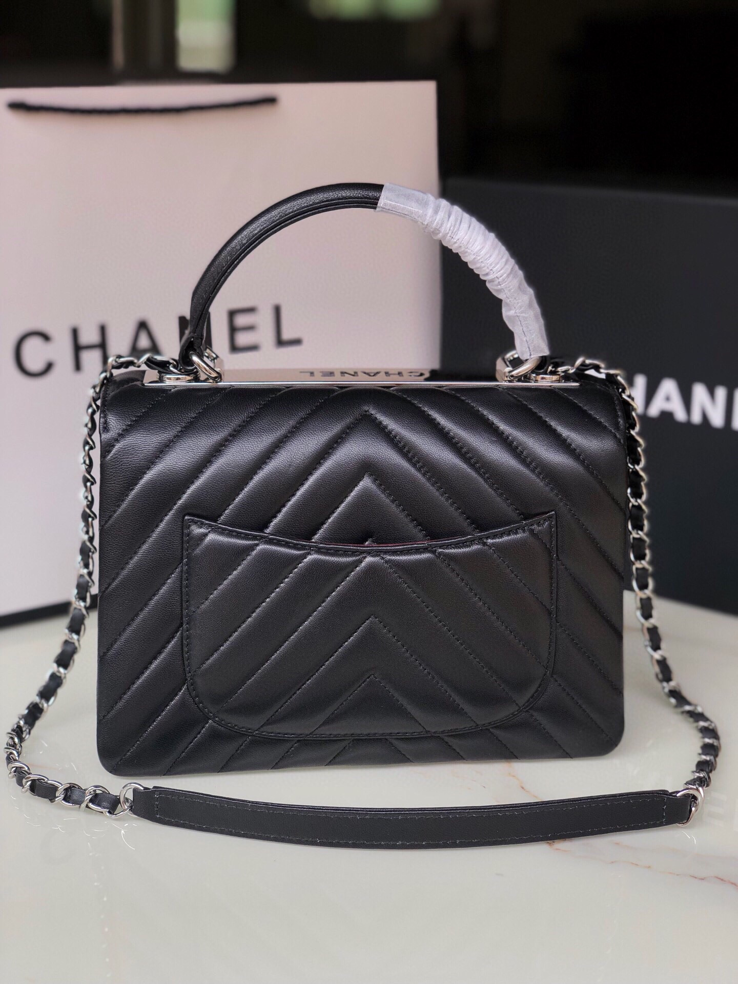 Ch*el flap bag with top handle 6.6 × 9.8 × 4.7 in